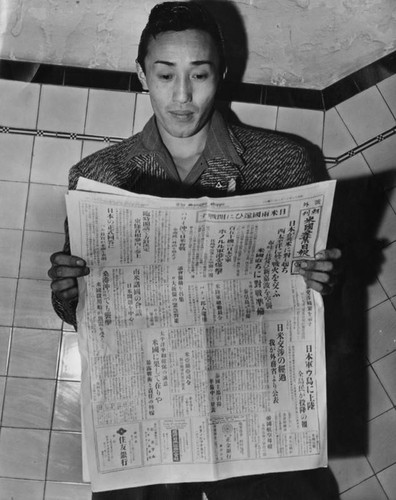 Man reading newspaper