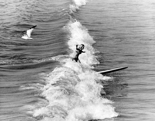 Kim Hoeppner on her surfboard