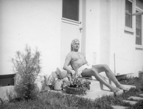 Herman Schultheis on the steps at home