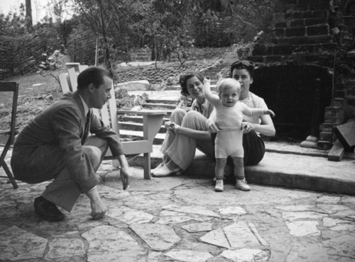 Gathering around a toddler, Universal City patio