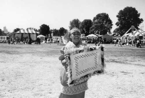 Woman with tapestry at Pacific Islander Festival