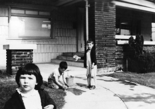 Children cleaning front porch