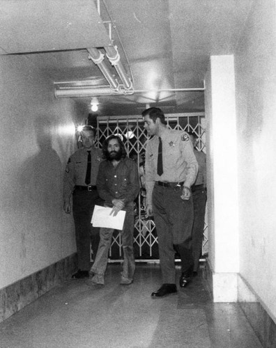 Charles Manson led from court