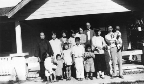 Chinese American family in front of house