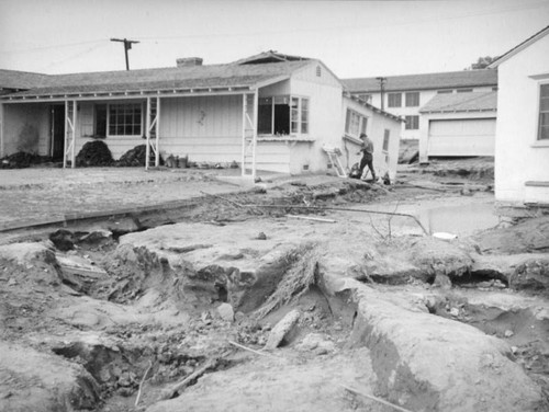 L.A. River flooding, inspecting a damaged house in North Hollywood