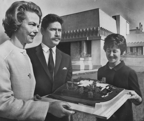 Architect Herbert Kahn and Junior League members view model of the Junior Arts Center at Barnsdall Park