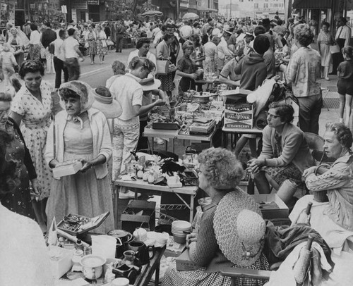 Crowd of shoppers at rummage sale