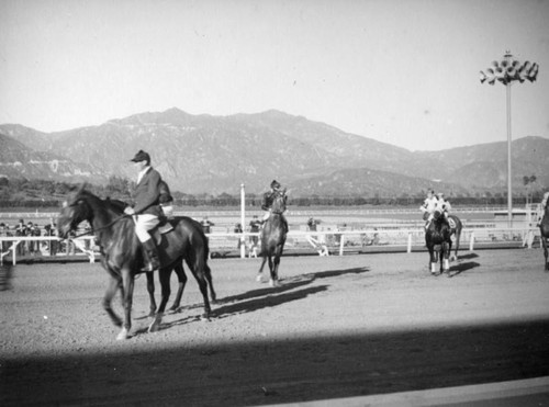 Jockeys and horses on the track at Santa Anita