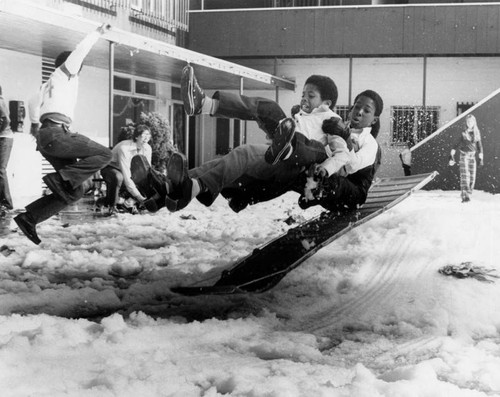 Children play in snow