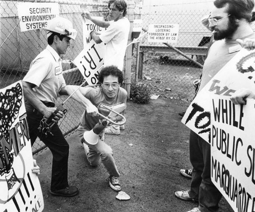 Protestor and security guard clash