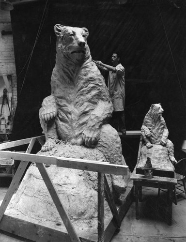 Sculptor finishing short-faced bear statue