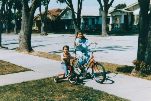 Sisters biking in the neighborhood