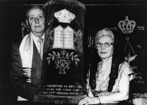 Couple presents Torah to temple