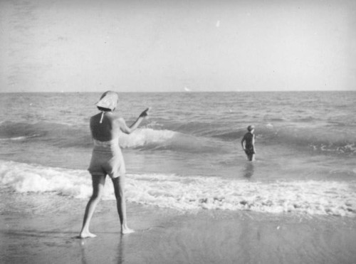 Walking into the surf at Newport Beach