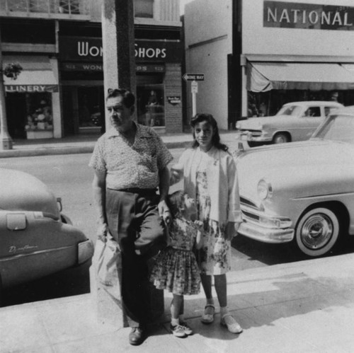 Mexican Americans on sidewalk