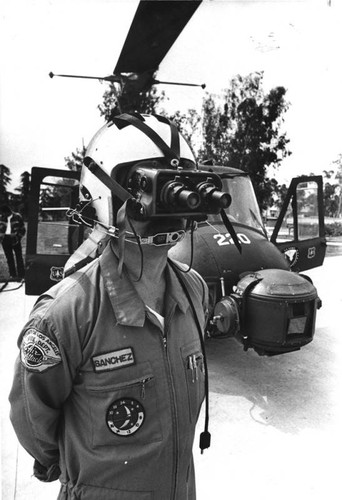 Jim Sanchez displays nightvision goggles