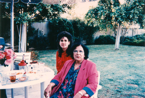 Mother and daughter in backyard