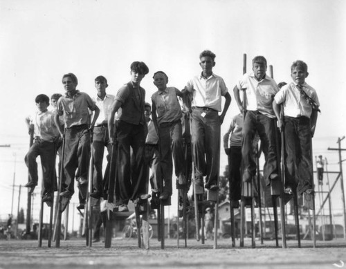 Boys on stilts