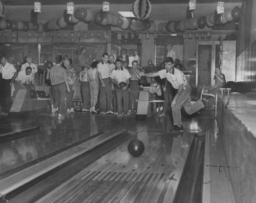 Young man bowling