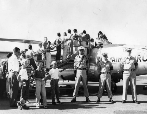 Children inspect jet aircraft