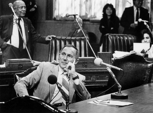 Chief Gates listens while City Council debates