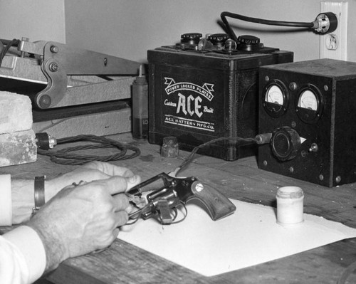 Cleaning a gun in LAPD Scientific Unit