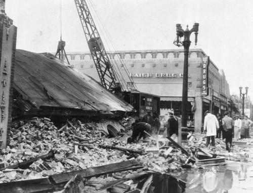 Crane removing earthquake debris