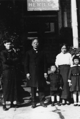 Family in front of Chinese Herb Company