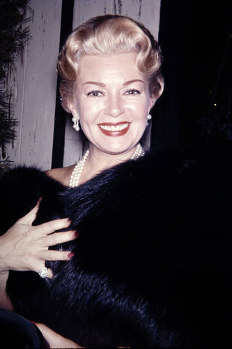 Lana Turner attends a movie premiere