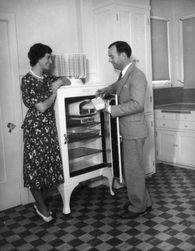 Woman looking at refrigerator