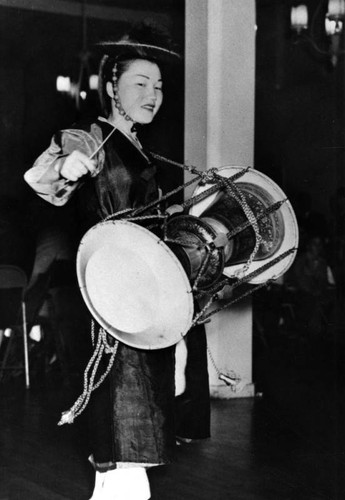 Performer with drum