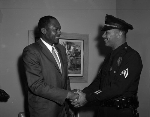 Tom Bradley greets LAPD officer