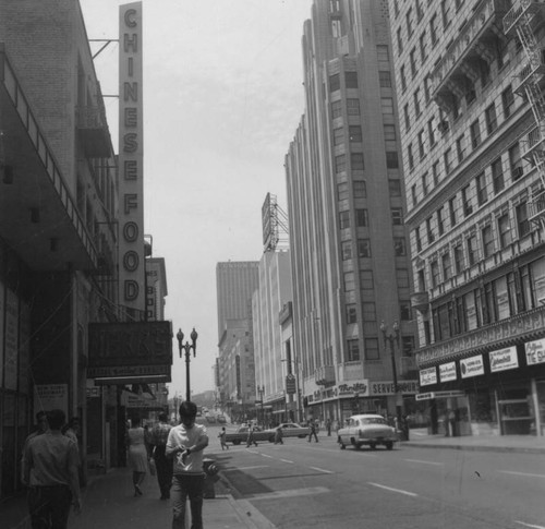 A man checks the time on Broadway