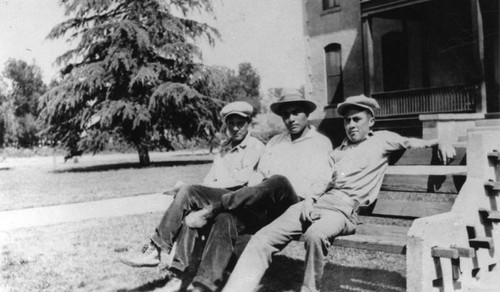 American Indian men on bench