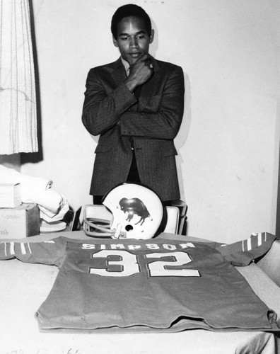 O. J. looks over uniform