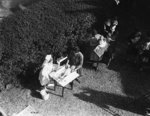 Infants being weighed