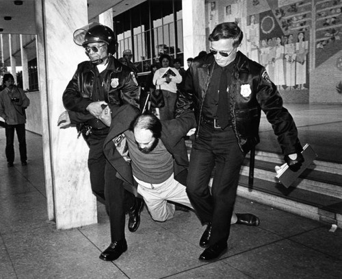 Protester removed from the Federal Building