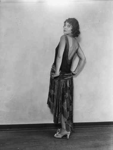 Dolly Jarvis in evening gown poses for the camera, view 2