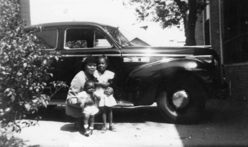 Family in a driveway