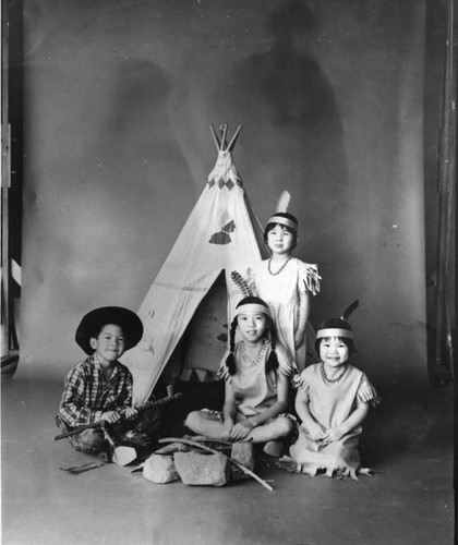 Chinese American children as cowboy and Indians