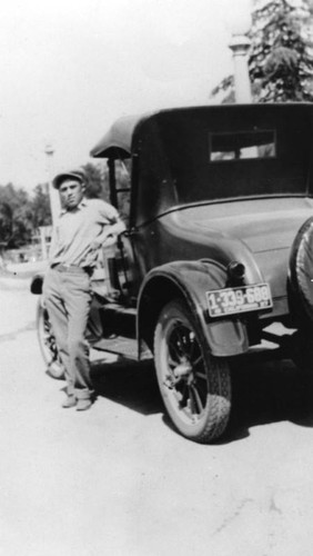 American Indian man with car