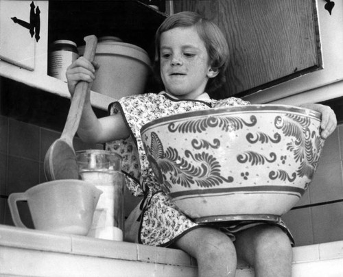 The mixing bowl is almost as big as Thanksgiving to a little girl