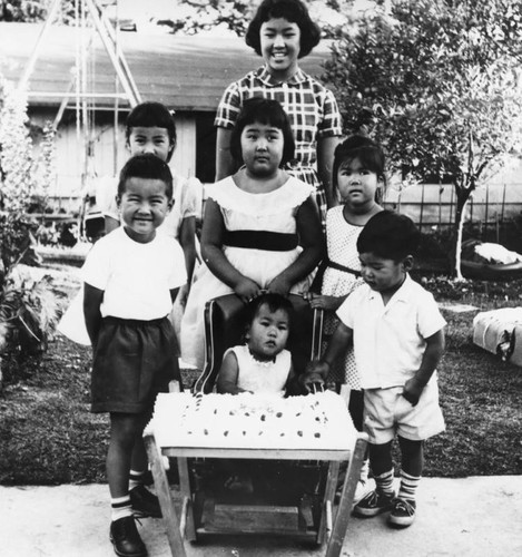 Japanese American children with birthday cake