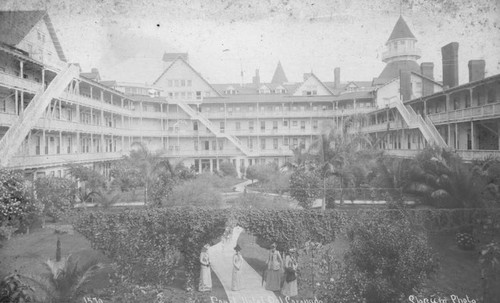 Ladies strolling along Hotel del Coronado's courtyard