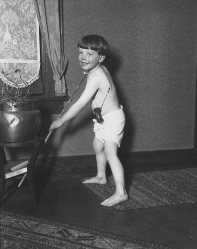 Young boy dressed as New Year baby