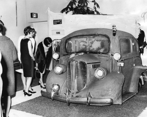 Museums visitors viewing Back Seat Dodge, 38