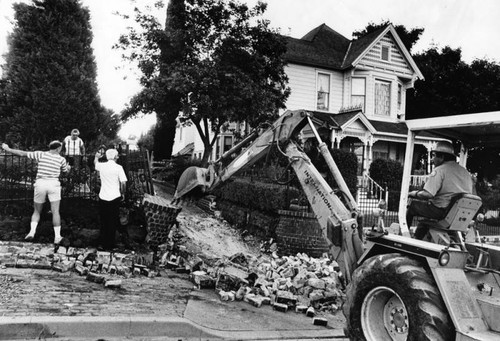 Clearing rubble at Painter Avenue and Beverly Blvd