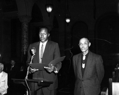 Councilman Tom Bradley gives a commendation