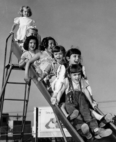 Young girls on a slide, a closeup view