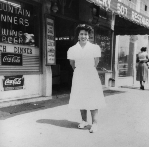 Waitress in front of La Esperanza Bakery and Restaurant